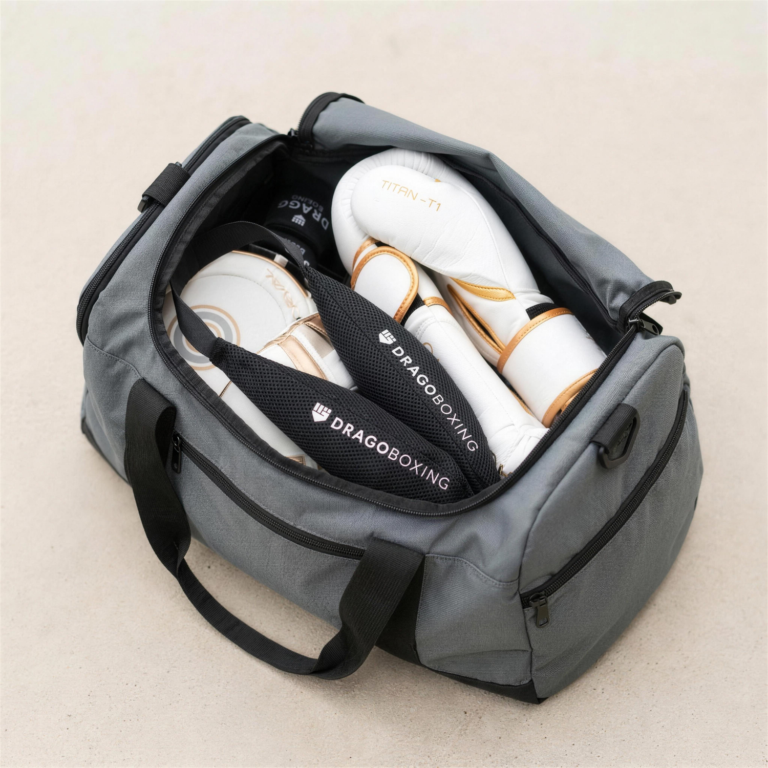 Drago glove deodorizer pouches in an open gym bag with boxing gloves