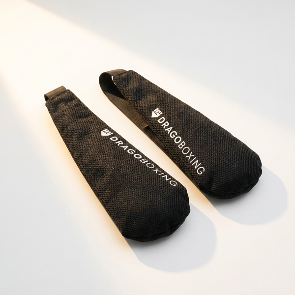 Drago glove deodorizer pouches in sunlight on a white studio background
